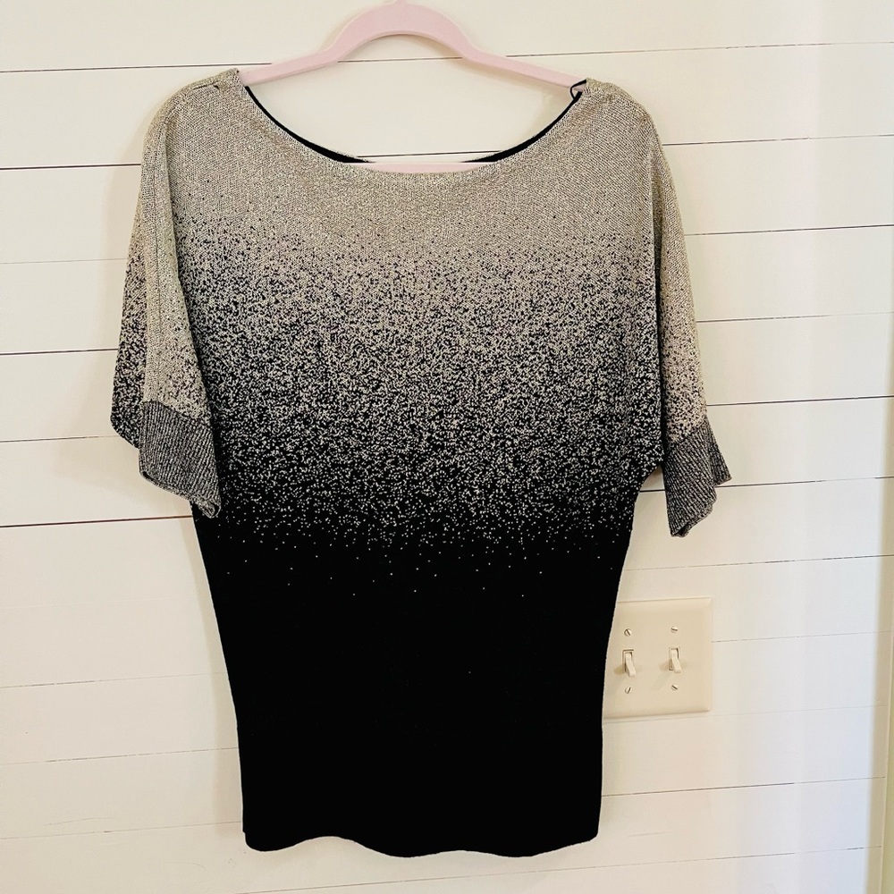 Metallic gold and black top.